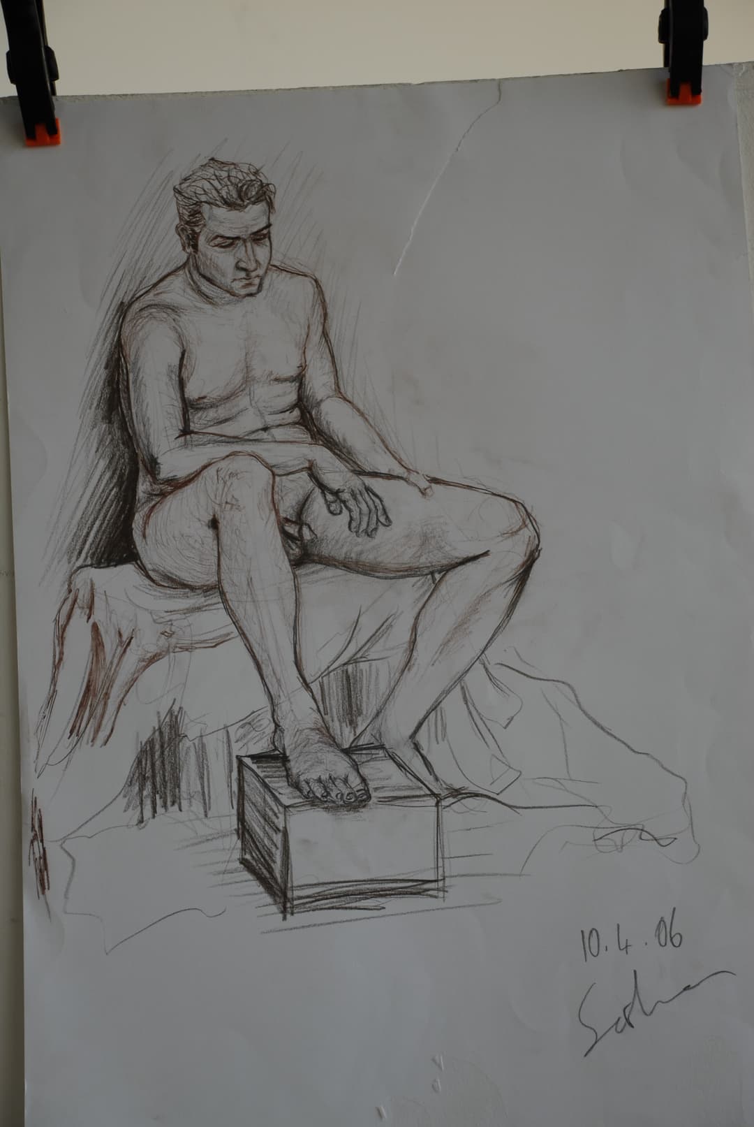 A sketch of a reclining figure, drawn with loose and expressive lines.